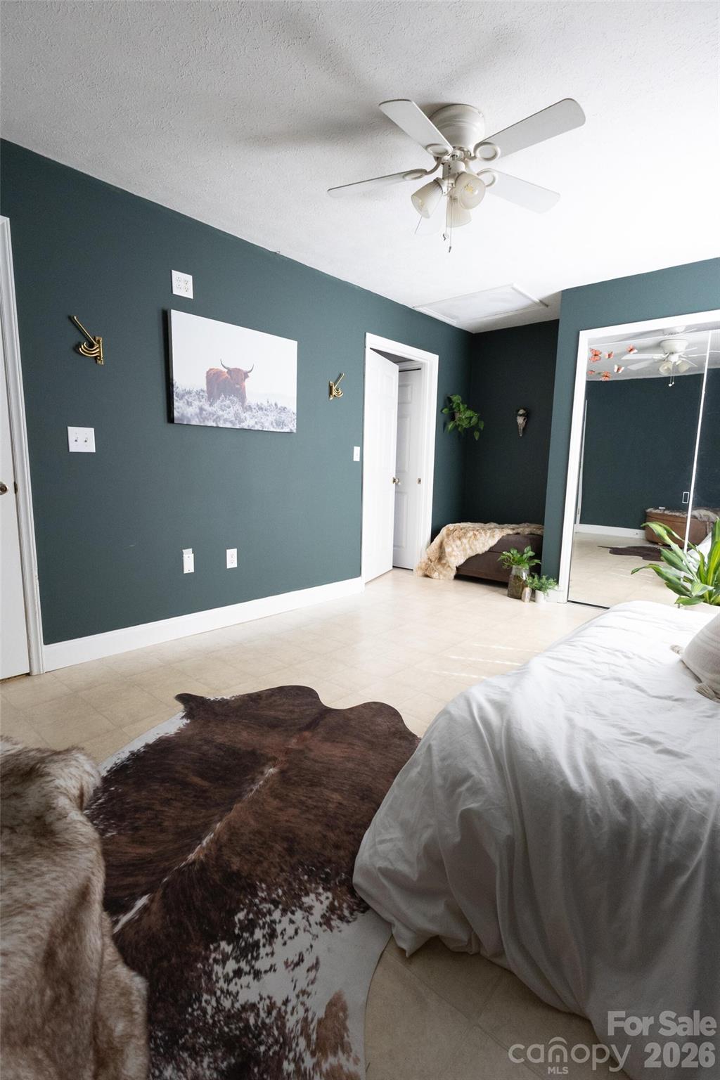 3780 Cook Road Valdese, NC 28690 - Photo 27 of 47 a bedroom with a bed and a ceiling fan