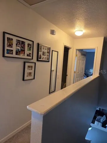 a view of a hallway with workspace