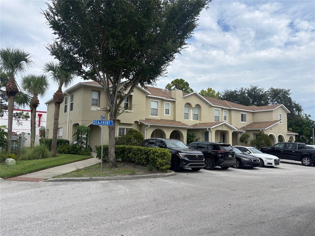 2013 Sea Front Court Clearwater, FL 33763 - Photo 2 of 17 a front view of a house with a garden