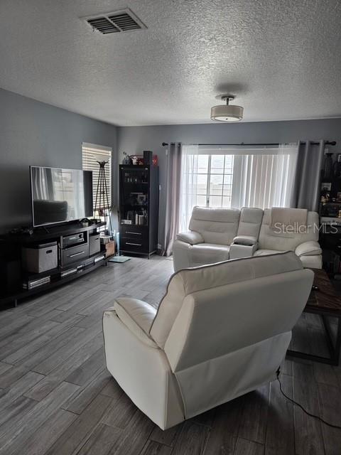 2013 Sea Front Court Clearwater, FL 33763 - Photo 4 of 17 a living room with furniture and a flat screen tv
