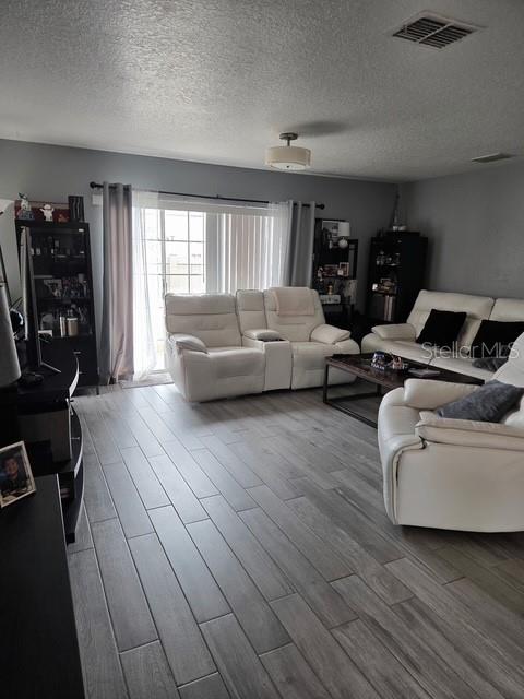 2013 Sea Front Court Clearwater, FL 33763 - Photo 5 of 17 a living room with furniture and wooden floor