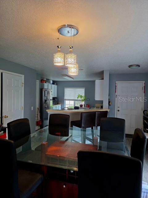 2013 Sea Front Court Clearwater, FL 33763 - Photo 7 of 17 a living room with furniture and a chandelier
