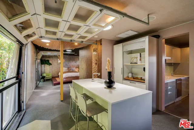 a bedroom with a bed and a couch