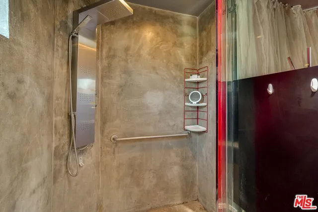 a kitchen with a stove a sink and wooden cabinets