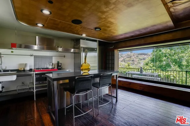 a room with wooden floor and furniture