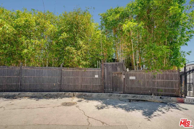 a view of a fence and trees