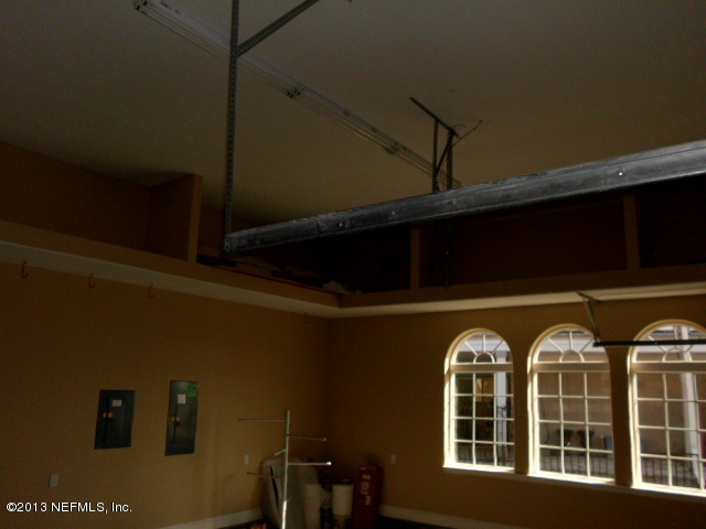 2124 Romeo Point Lane Fleming Island, FL 32003 - Photo 29 of 40 Built-in storage for garage