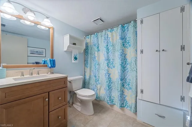 a living room with furniture and gym equipment