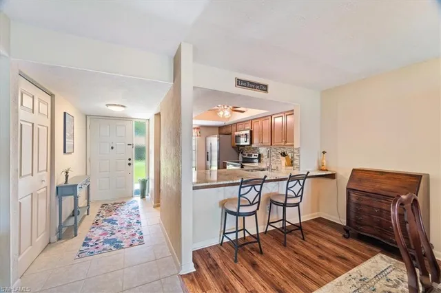 a kitchen with a sink stove and refrigerator