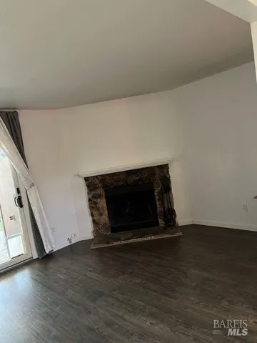 a view of a backyard with plants and a patio