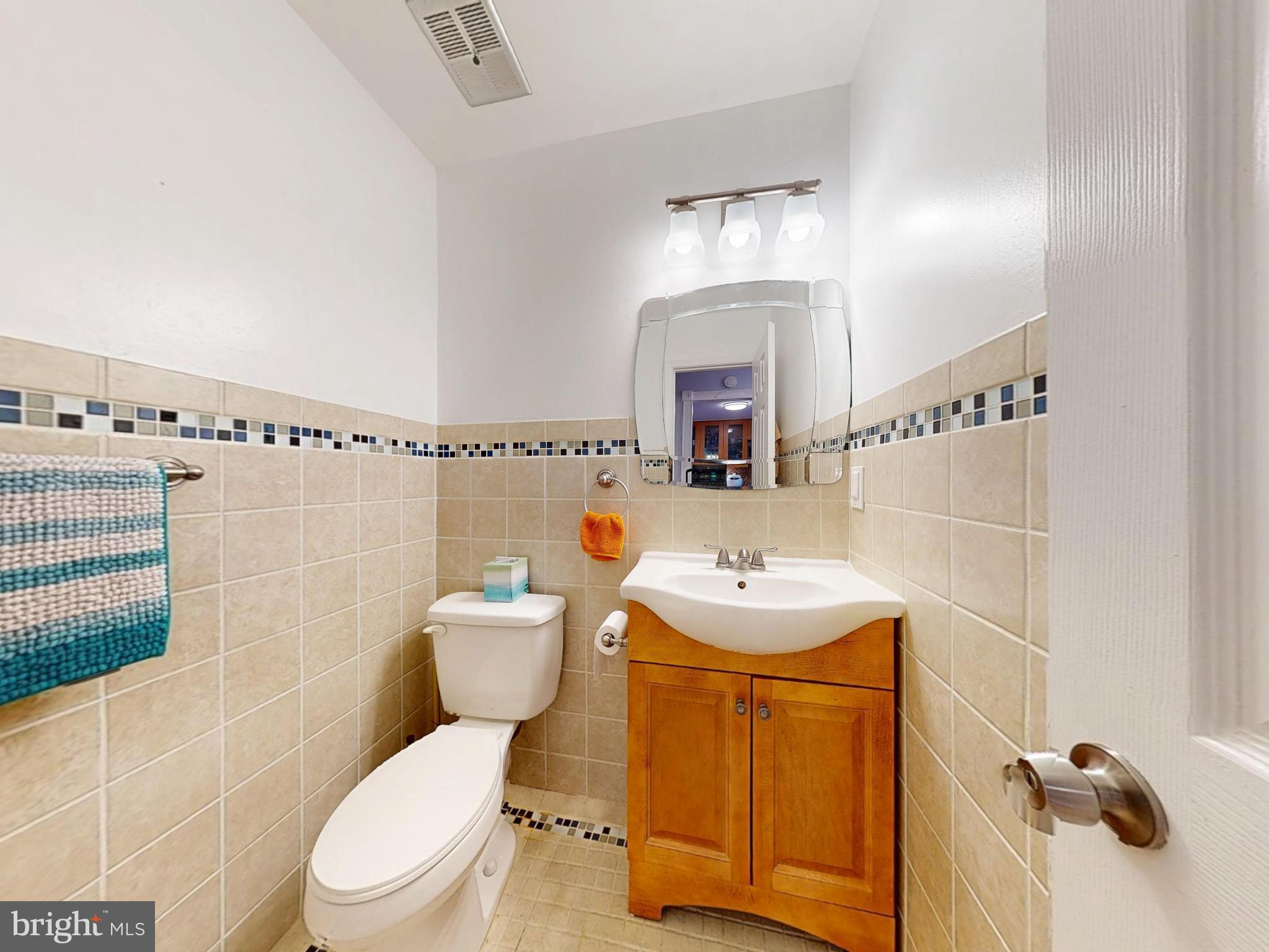 7302 Rolling Oak Lane Springfield, VA 22153 - Photo 10 of 34 Primary floor powder bathroom