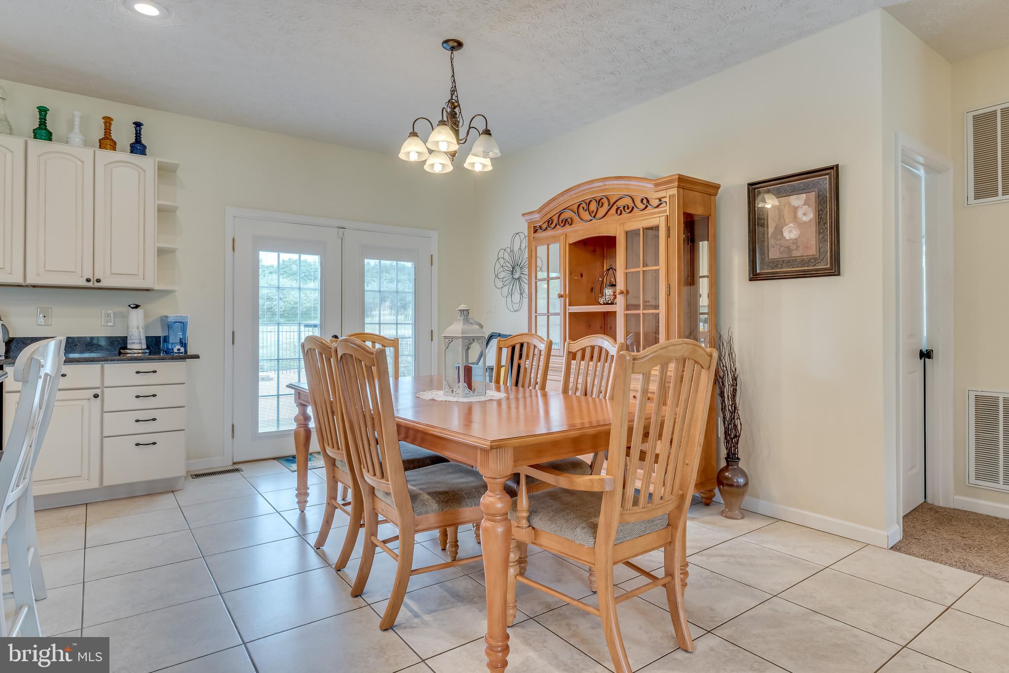 61 Torytown Road Bunker Hill, WV 25413 - Photo 20 of 57 Includes overhead lighting, walkout to the patio
