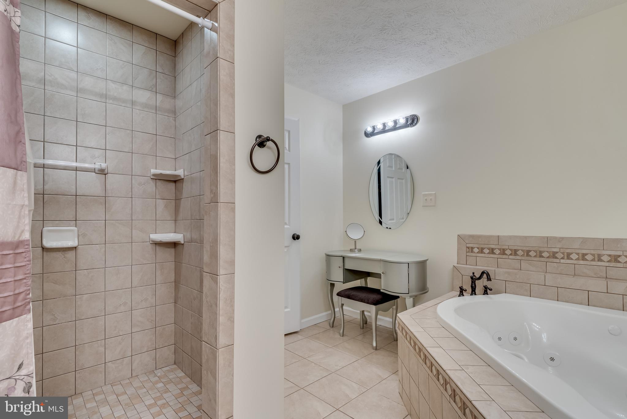 61 Torytown Road Bunker Hill, WV 25413 - Photo 28 of 57 Tile stall shower and soaking tub w/ tile surround