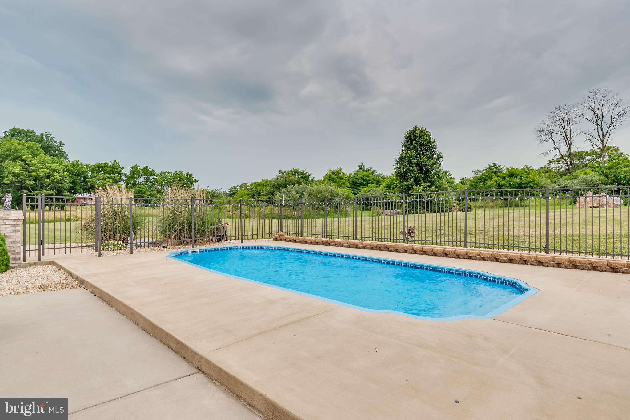61 Torytown Road Bunker Hill, WV 25413 - Photo 45 of 57 All surrounding this stunning inground pool!