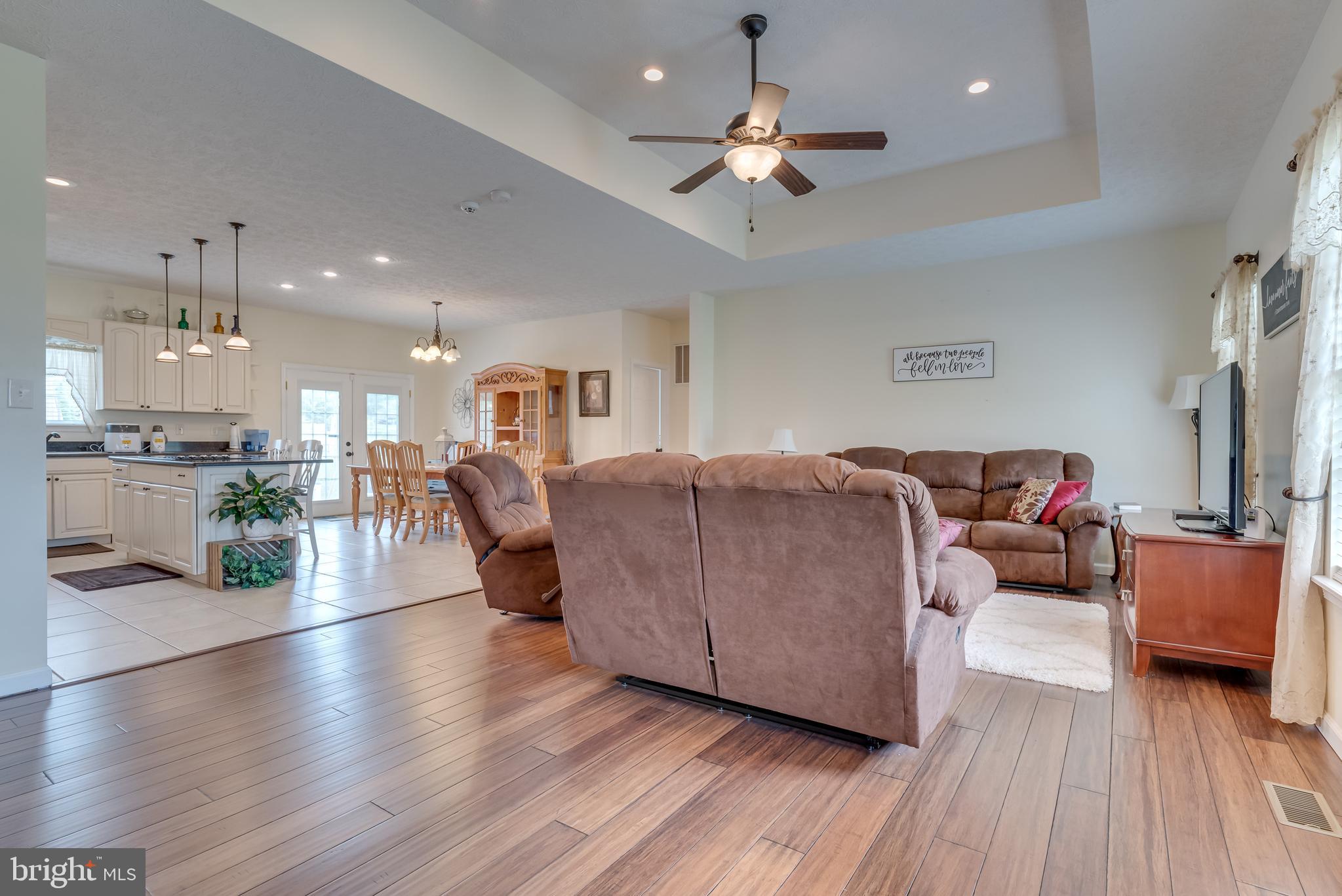 Hardwood continues into the large living room