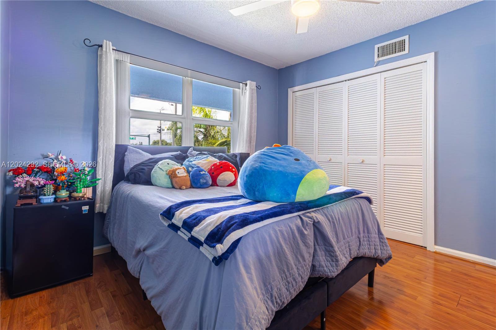 9780 Marina Boulevard, Unit 424 Boca Raton, FL 33428 - Photo 17 of 32 a bedroom with a bed and a window