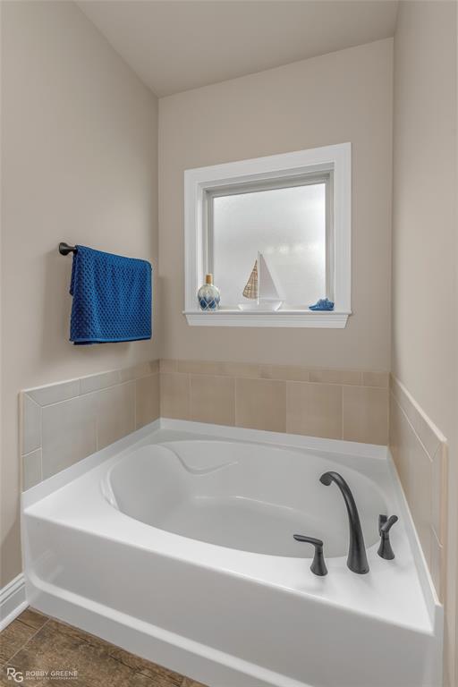 122 Brimestone Loop Benton, LA 71006 - Photo 18 of 33 a white bath tub and a window