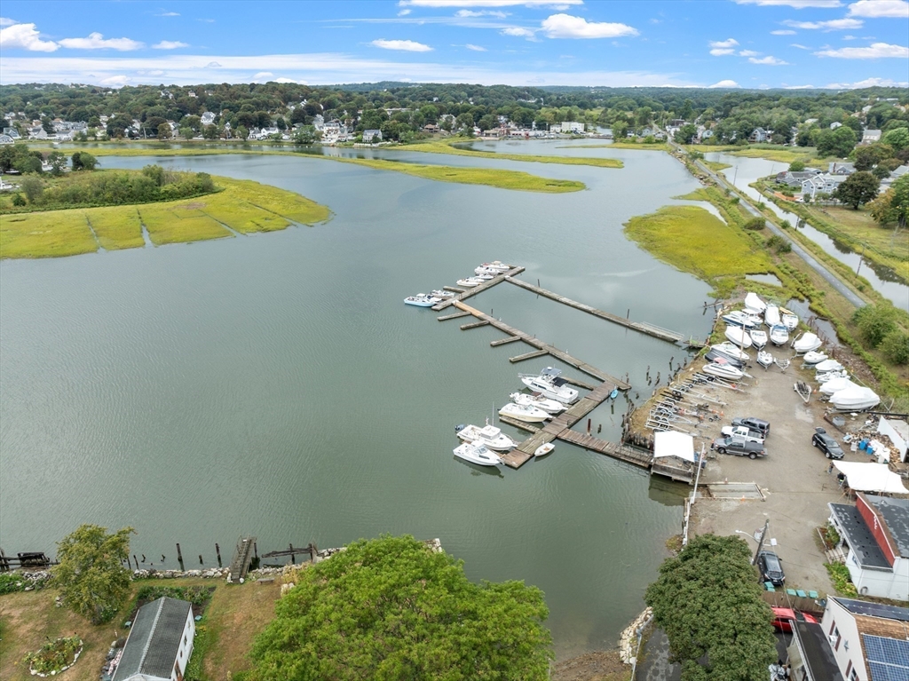 73 Dearborn Avenue, Unit 1 Lynn, MA 01905 - Photo 9 of 16 an aerial view of a residential houses with outdoor space and swimming pool