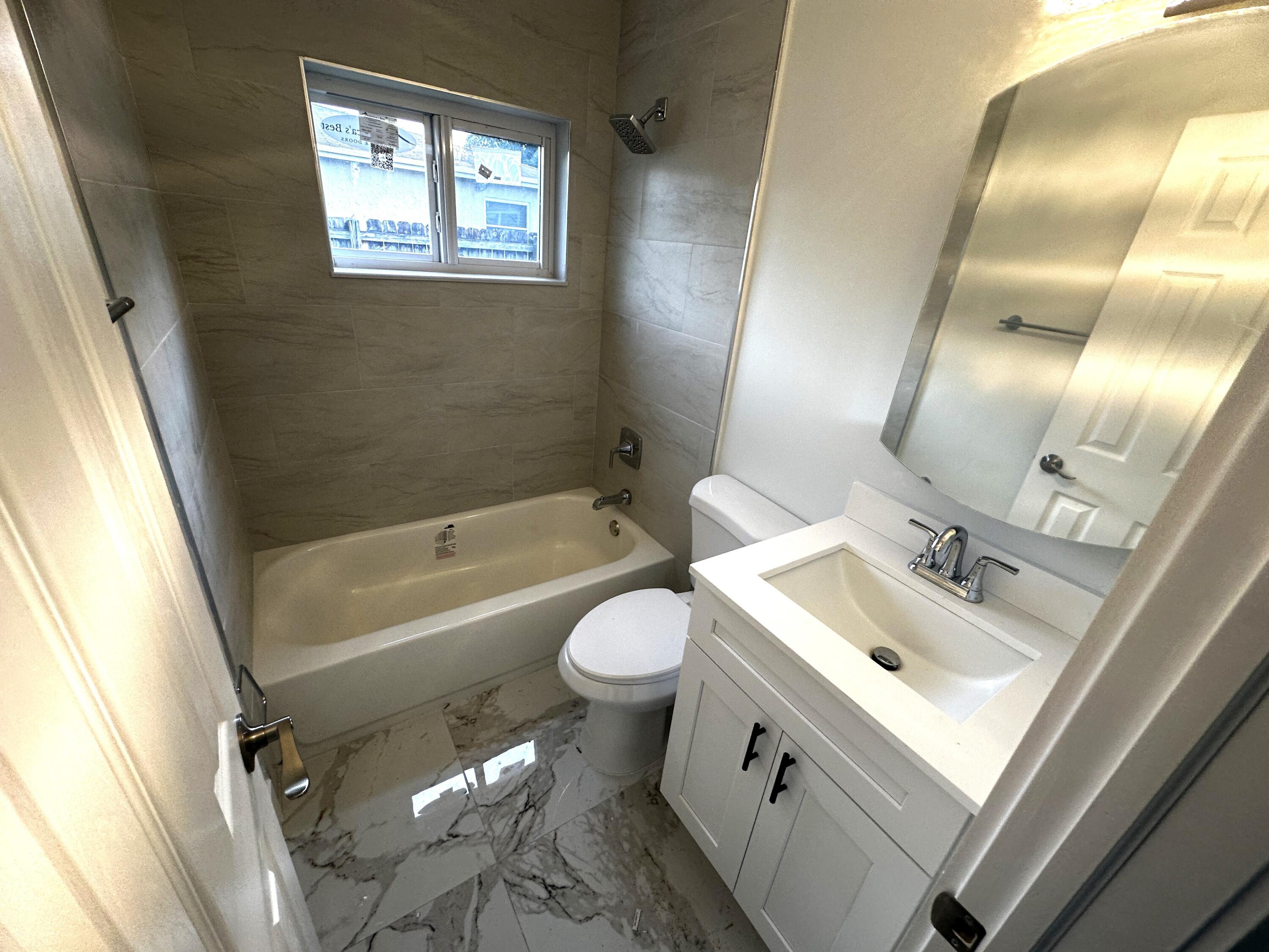 11150 Delta Circle Boca Raton, FL 33428 - Photo 11 of 17 a bathroom with a sink toilet and shower