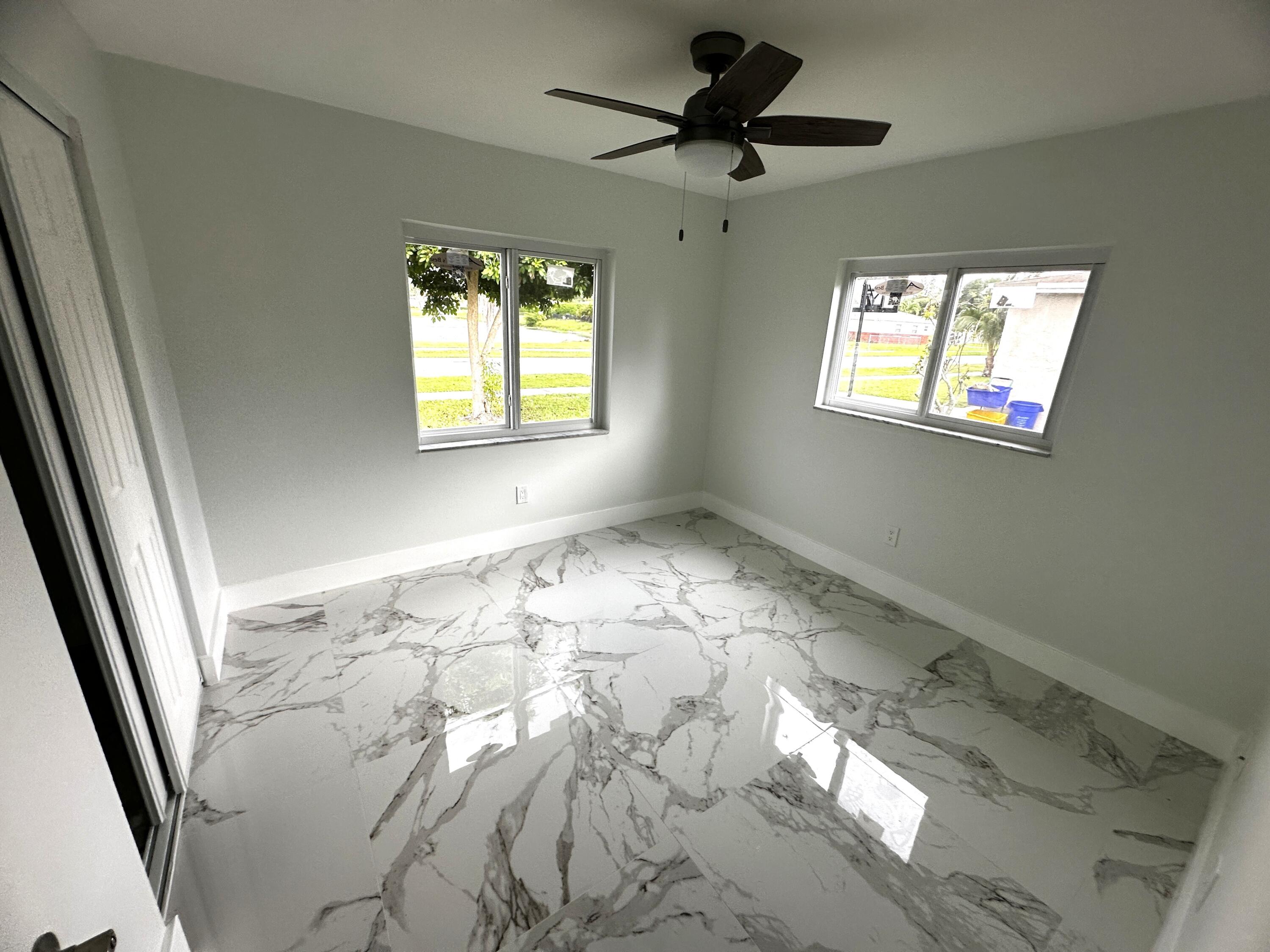 11150 Delta Circle Boca Raton, FL 33428 - Photo 12 of 17 wooden floor in an empty room with a window