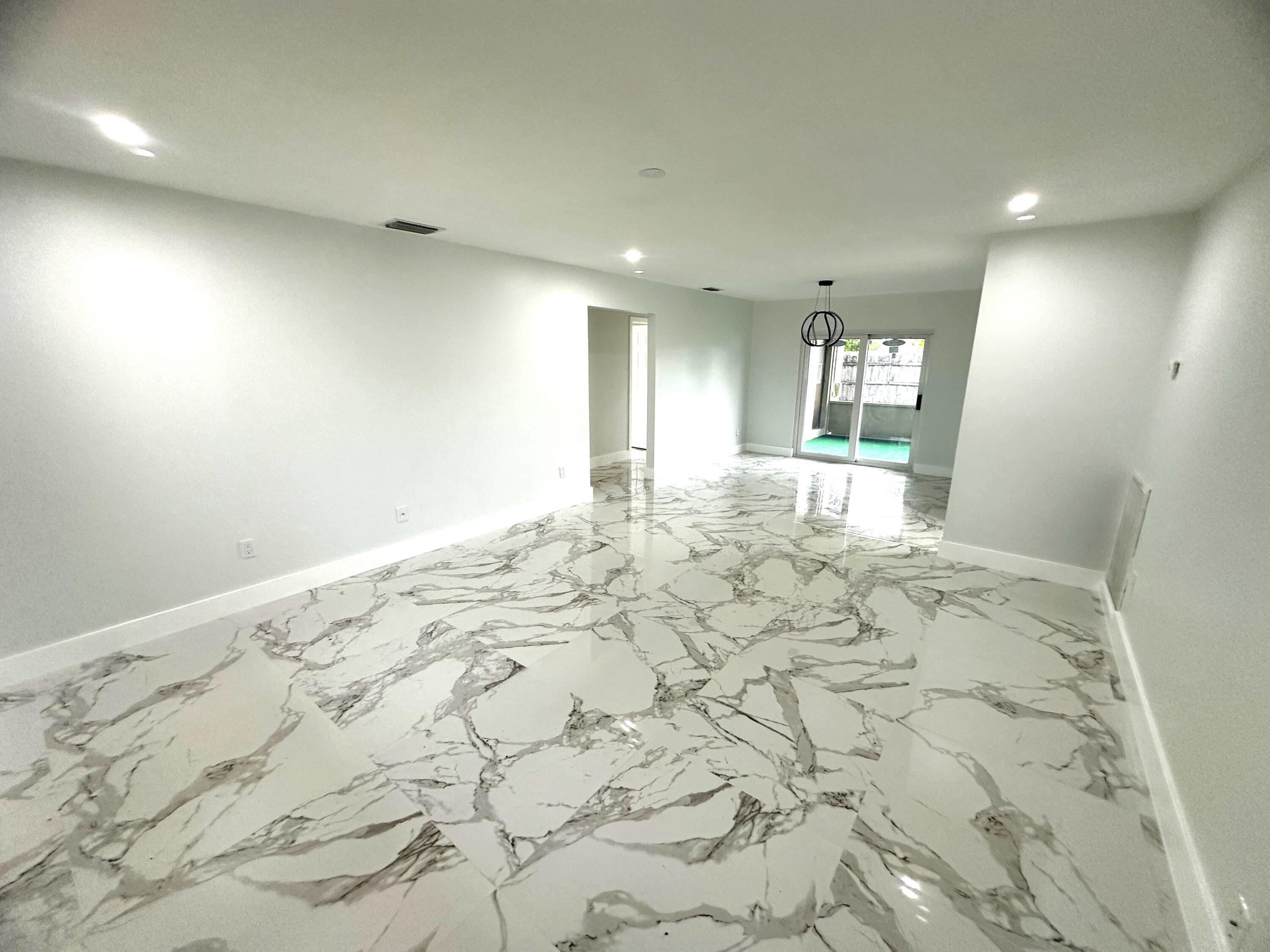 11150 Delta Circle Boca Raton, FL 33428 - Photo 7 of 17 a view of a hallway to a room with window
