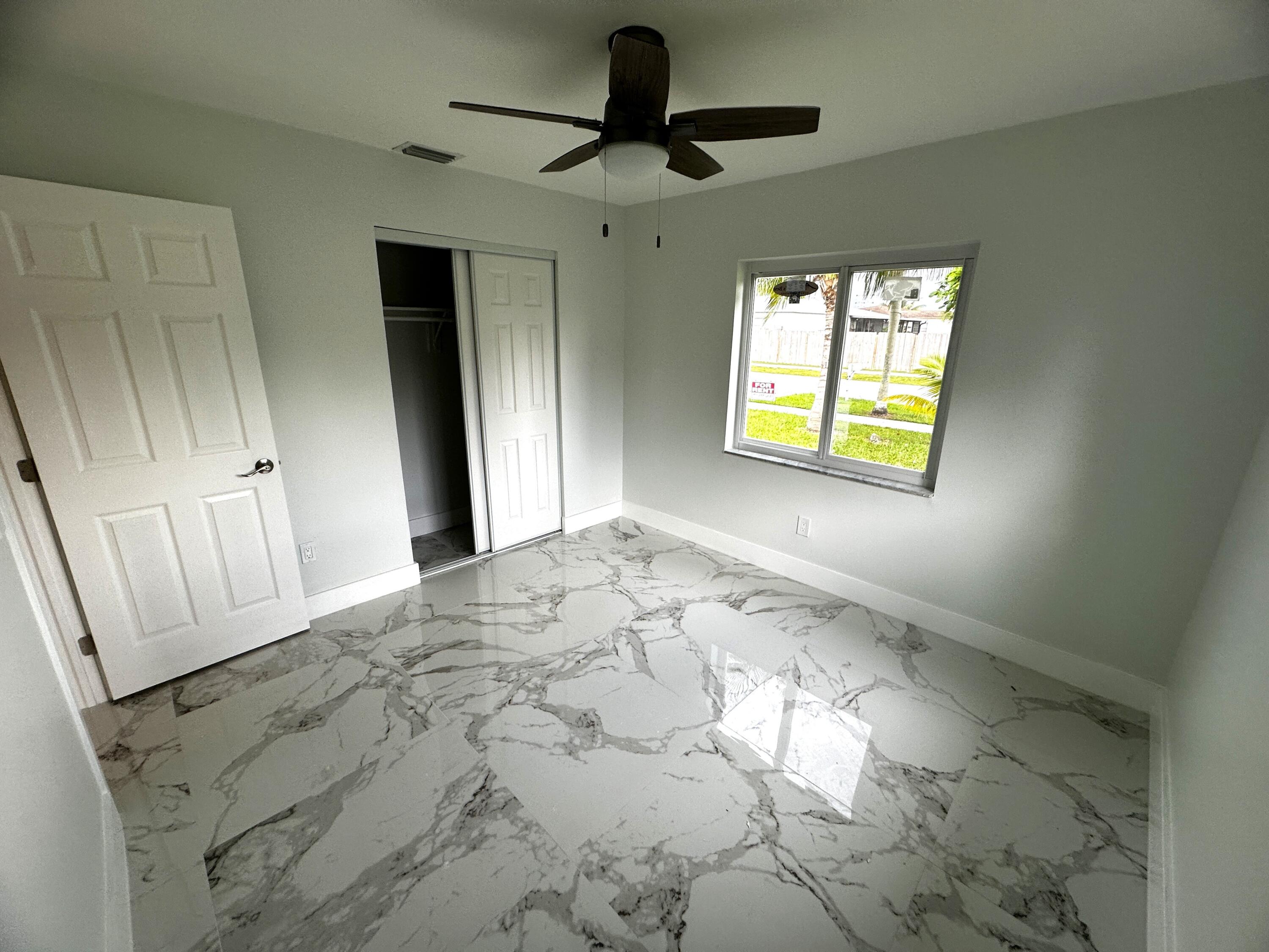 11150 Delta Circle Boca Raton, FL 33428 - Photo 10 of 17 a view of a hallway to a window