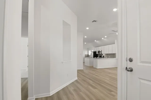 a view of a kitchen and kitchen island