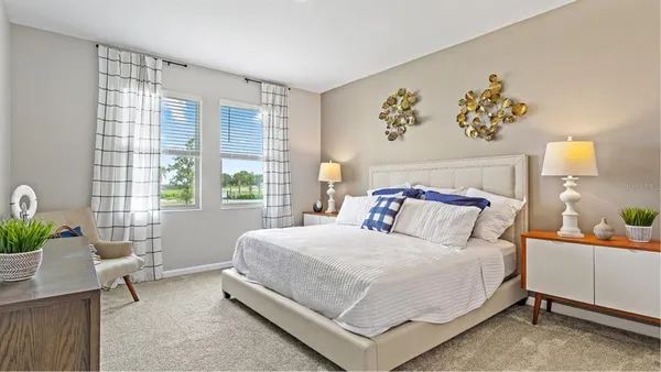 a bedroom with a bed and a table