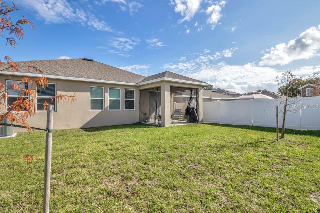 1106 James Paul Road Davenport, FL 33837 - Photo 16 of 21 a backyard of a house with lots of green space