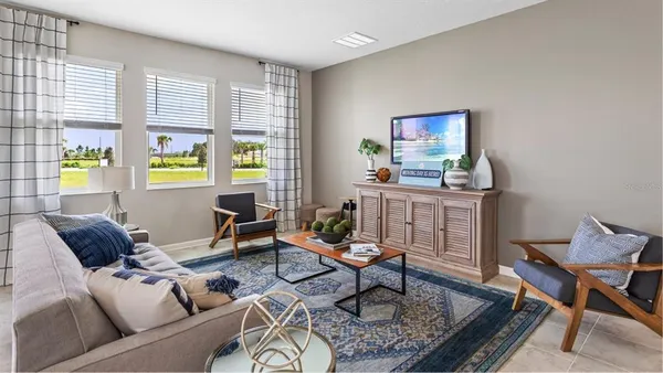 a living room with furniture and a window
