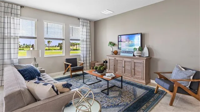 a living room with furniture and a window