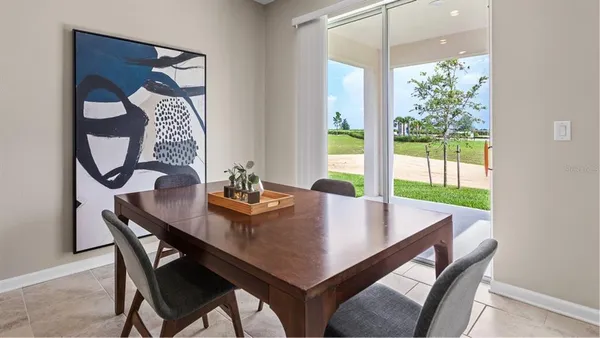 a view of a dining room with furniture window and outside view