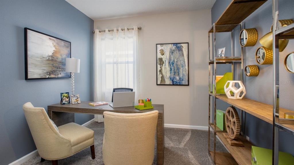 1106 James Paul Road Davenport, FL 33837 - Photo 8 of 21 a dining room with furniture and wooden floor