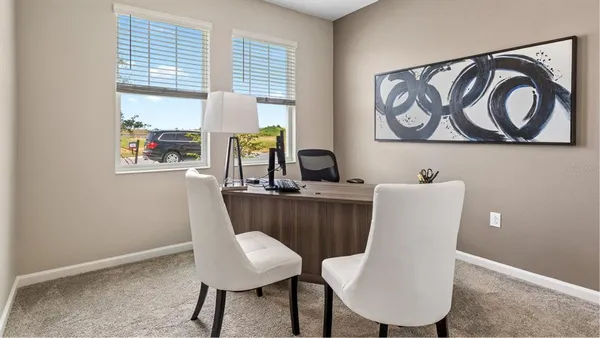 a view of dining room with furniture and window