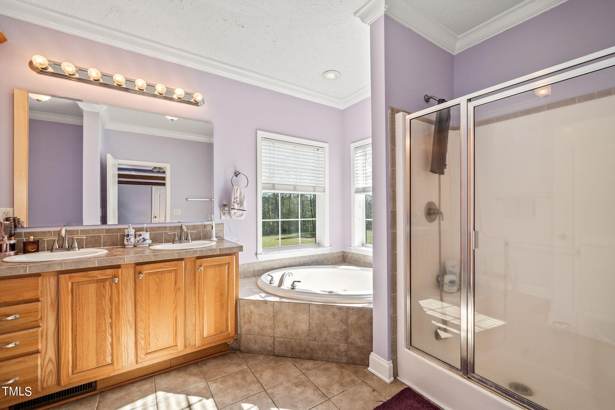 155 Esnon Road Chase City, VA 23924 - Photo 13 of 35 a bathroom with a granite countertop sink a mirror a vanity and a bathtub