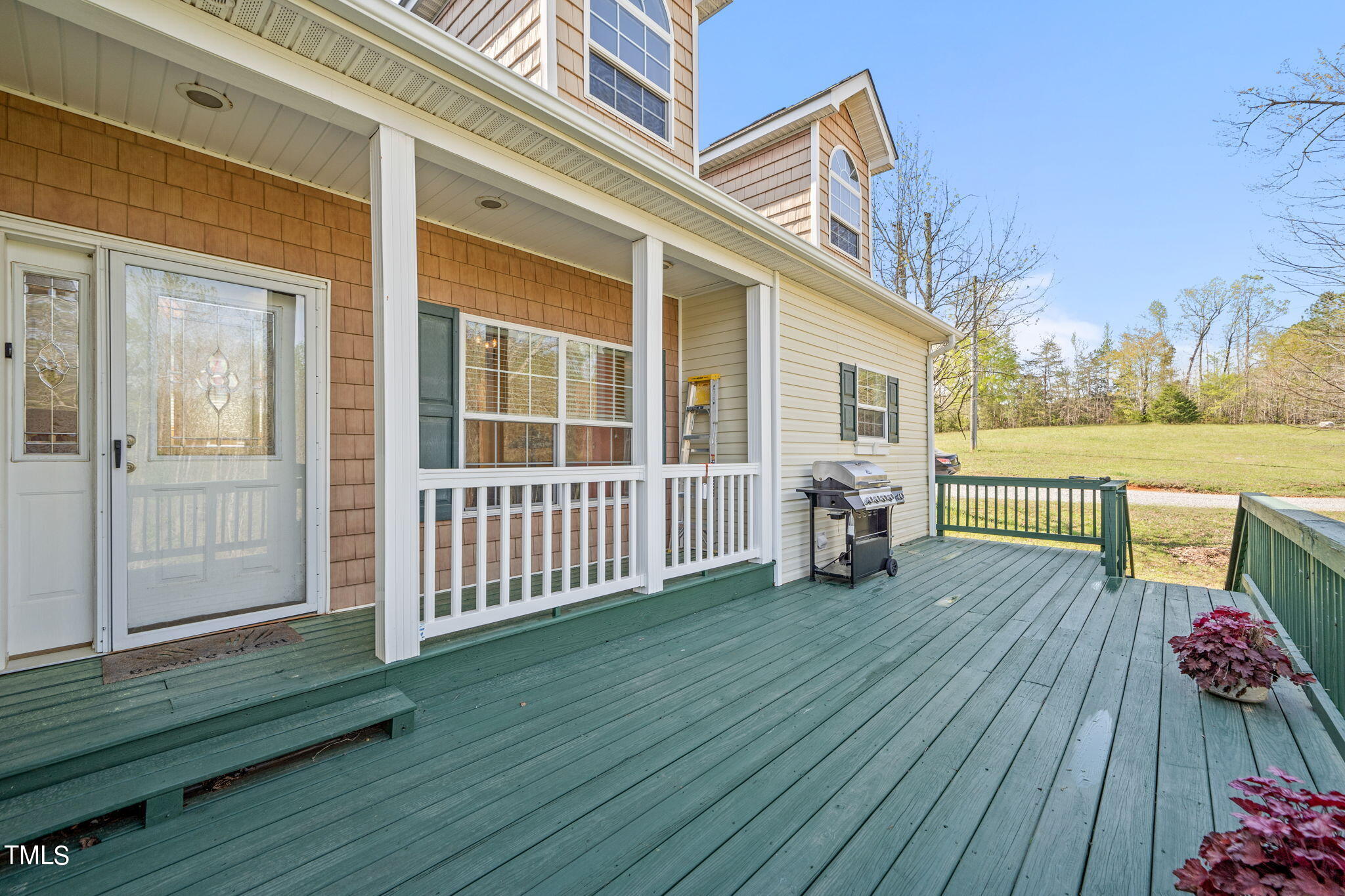 155 Esnon Road Chase City, VA 23924 - Photo 20 of 35 a view of a deck with wooden floor and floor to ceiling window
