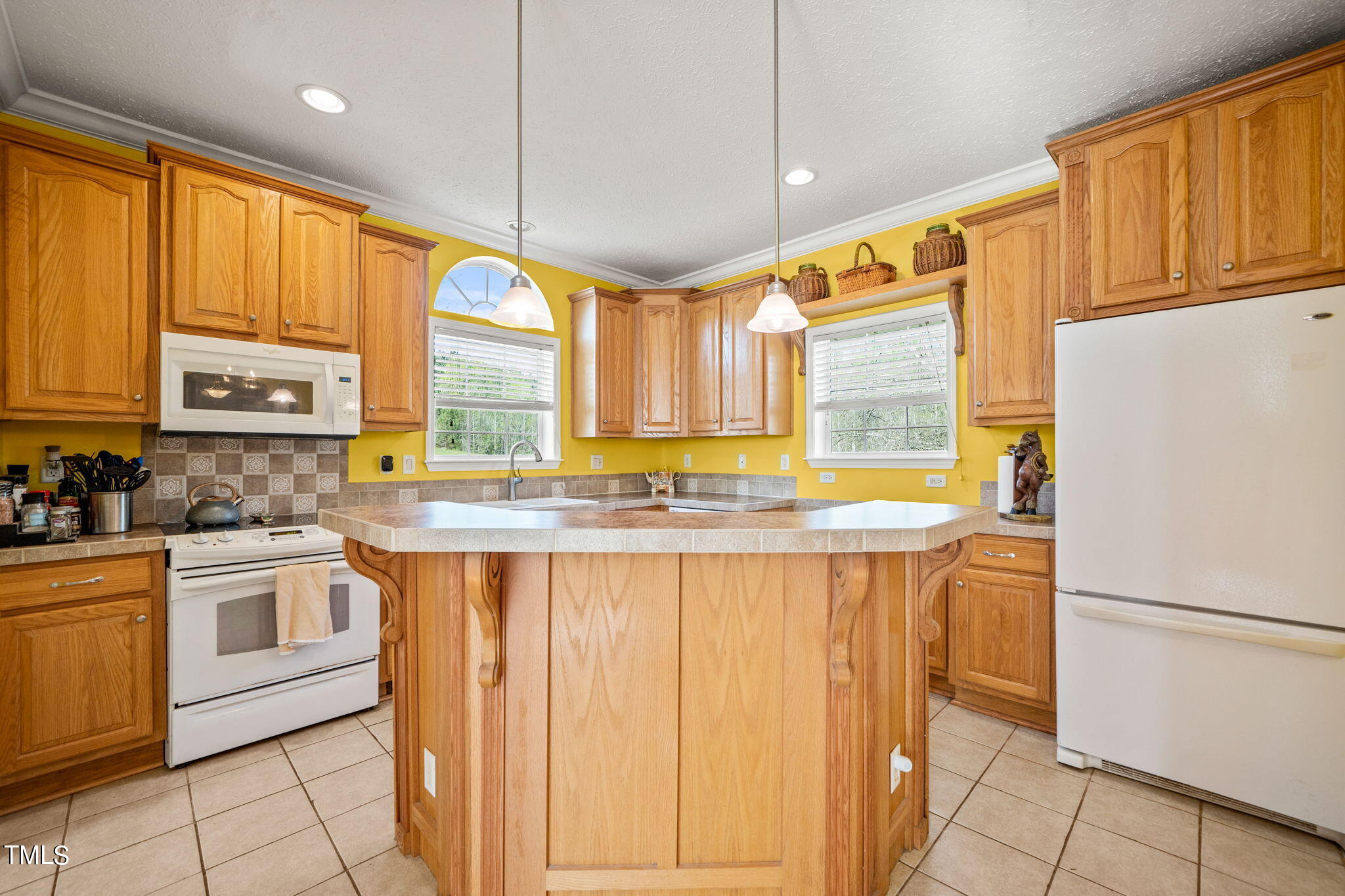 155 Esnon Road Chase City, VA 23924 - Photo 7 of 35 a kitchen with stainless steel appliances granite countertop a refrigerator a sink dishwasher and white cabinets with wooden floor