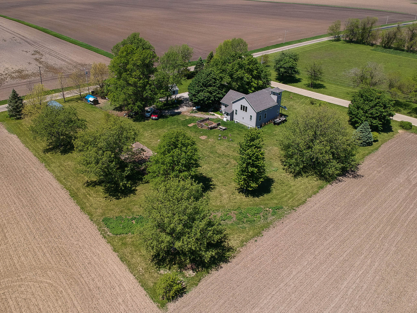 12014 Prairie Center Road Clinton, IL 61727 - Photo 50 of 56 a view of a garden with a building
