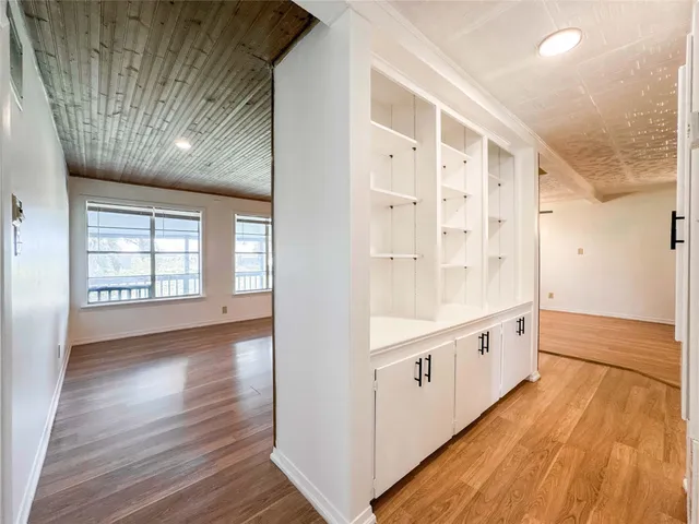 a view of an entryway with wooden floor