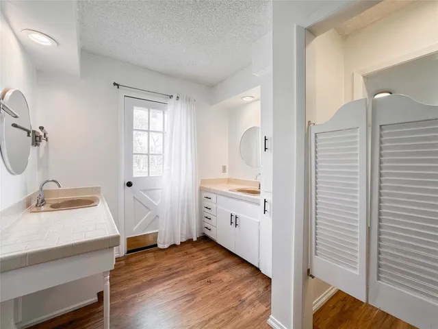 a room with a sink and a mirror