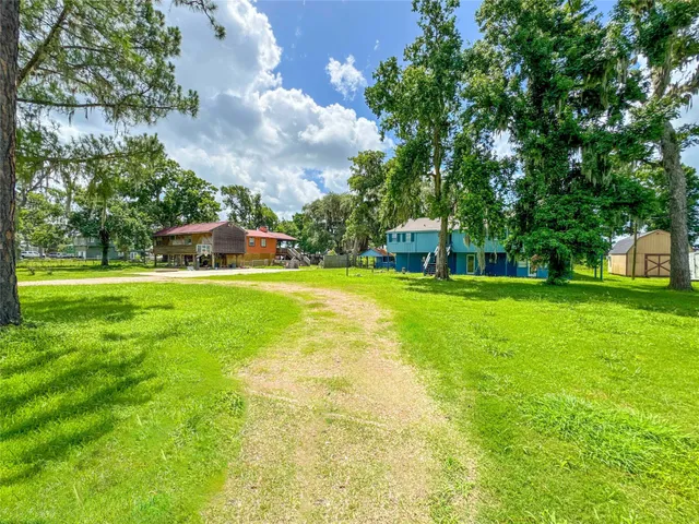 a view of a house with a big yard