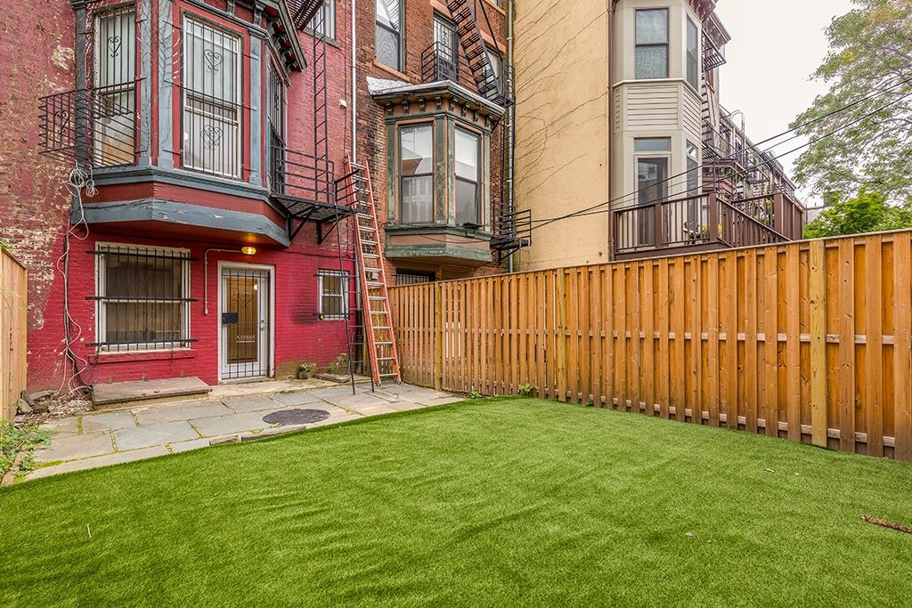 118 Mercer Street Jersey City, NJ 07302 - Photo 23 of 33 a view of a porch with a yard