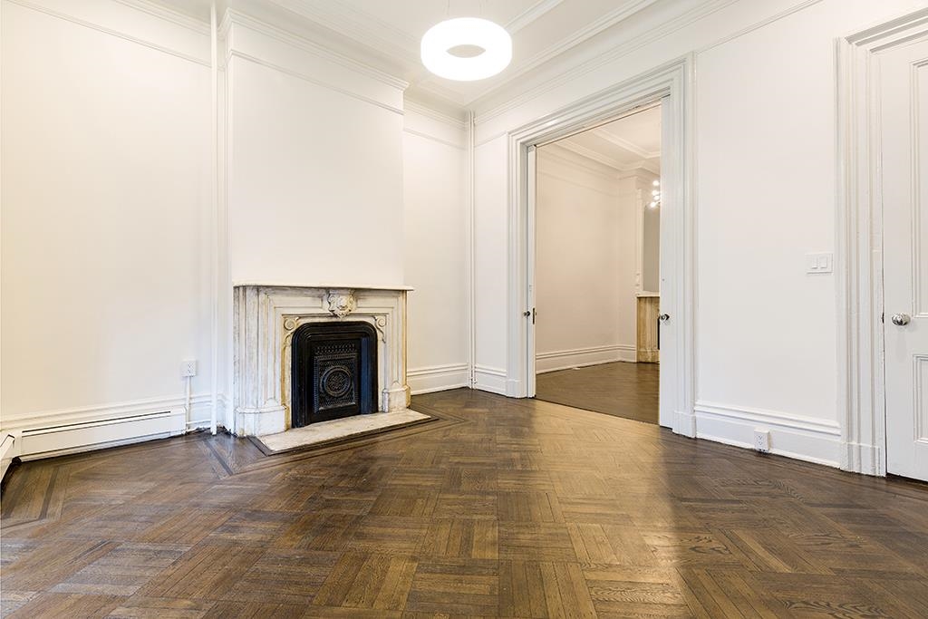 118 Mercer Street Jersey City, NJ 07302 - Photo 5 of 33 a view of a livingroom with a fireplace