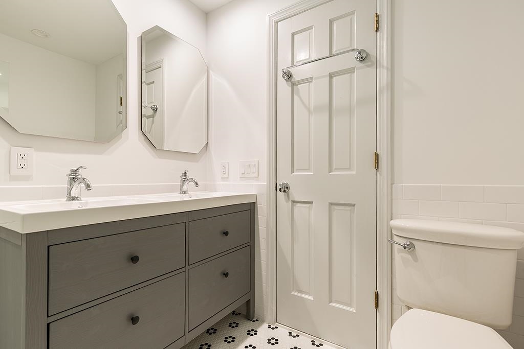 118 Mercer Street Jersey City, NJ 07302 - Photo 6 of 33 a bathroom with a sink a toilet and shower