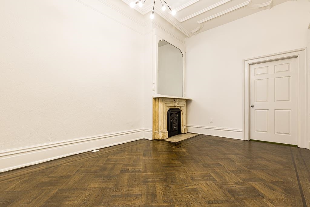 118 Mercer Street Jersey City, NJ 07302 - Photo 8 of 33 an empty room with an entryway