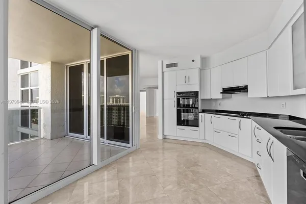 a view of a balcony with chairs