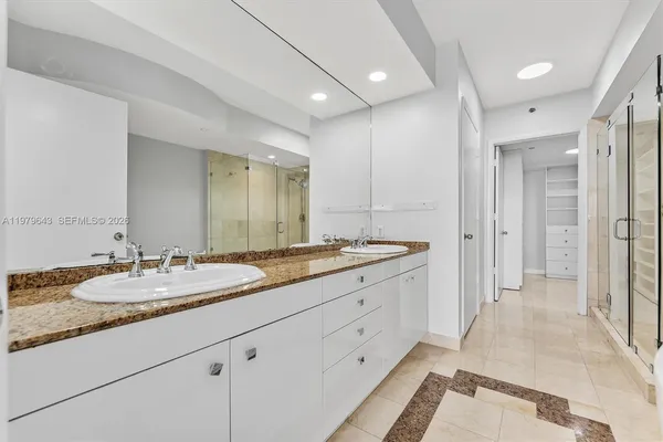 a bathroom with a tub and shower