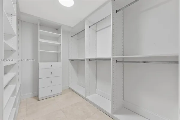a view of an empty walk in closet
