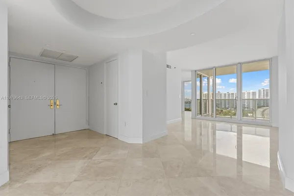 a view of an empty room with a sliding door