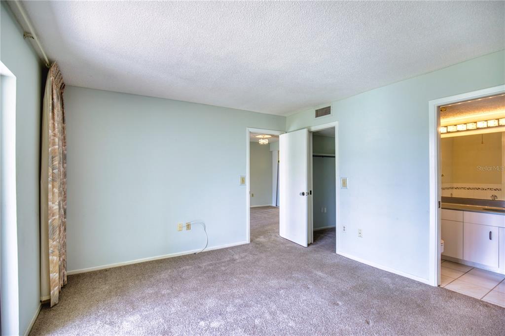 102 Capri Isles Boulevard, Unit 207 Venice, FL 34292 - Photo 14 of 25 a view of an empty room and a window